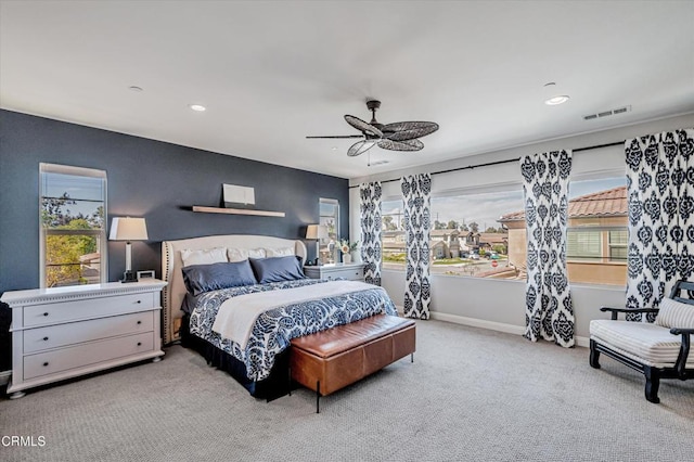 carpeted bedroom featuring visible vents, baseboards, a ceiling fan, and recessed lighting