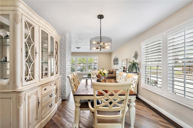 5303 Avondale Way, Riverside, CA 92506 - dining room featuring baseboards, dark wood-style floors, and a notable chandelier