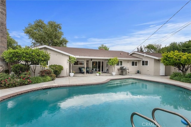 5303 Avondale Way, Riverside, CA 92506 - view of pool featuring a patio, a ceiling fan, a fenced in pool, and a grill