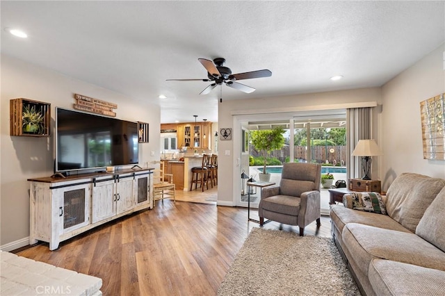 5303 Avondale Way, Riverside, CA 92506 - living room with recessed lighting, a ceiling fan, baseboards, and wood finished floors