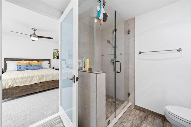 2818 Francis Ln, Costa Mesa, CA 92626 - full bathroom featuring a stall shower, wood finished floors, baseboards, toilet, and connected bathroom
