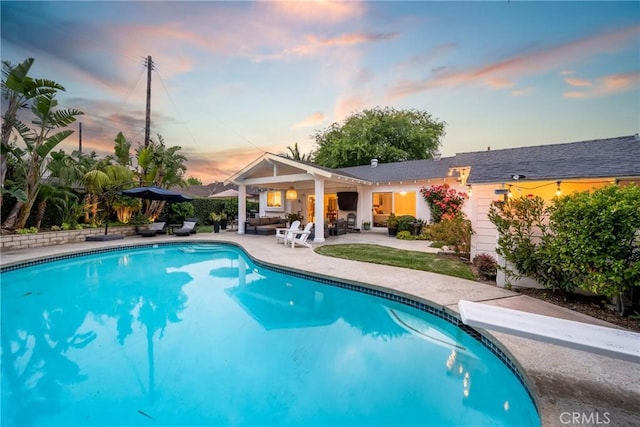 2818 Francis Ln, Costa Mesa, CA 92626 - pool at dusk with a patio area and an outdoor pool