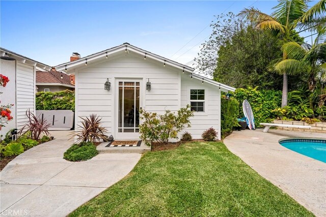 2818 Francis Ln, Costa Mesa, CA 92626 - back of property with a lawn, a patio area, and an outdoor pool
