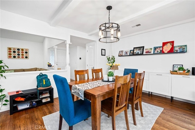 2818 Francis Ln, Costa Mesa, CA 92626 - dining area featuring beamed ceiling, a notable chandelier, wood finished floors, and visible vents
