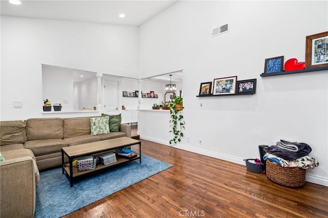 2818 Francis Ln, Costa Mesa, CA 92626 - living room with high vaulted ceiling, baseboards, wood finished floors, and visible vents