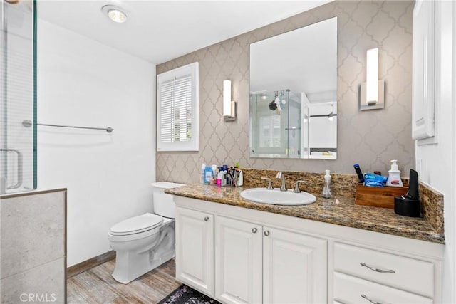 2818 Francis Ln, Costa Mesa, CA 92626 - bathroom featuring toilet, a shower stall, wood finished floors, and vanity