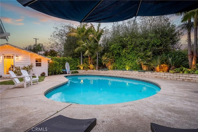2818 Francis Ln, Costa Mesa, CA 92626 - pool at dusk featuring a patio and an outdoor pool