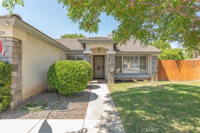 29129 Crestline Dr, Menifee, CA 92584 - view of front of home with stone siding, a tile roof, and stucco siding