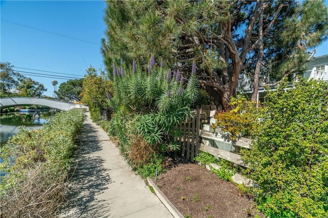 view of community with fence