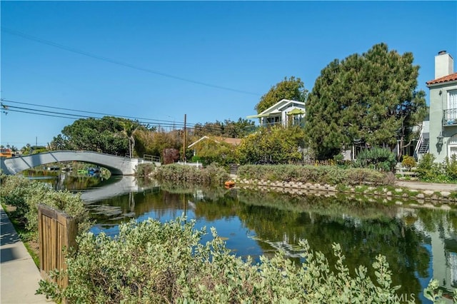 view of home's community featuring a water view