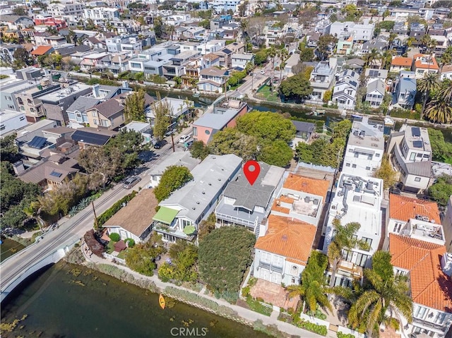 bird's eye view featuring a water view and a residential view