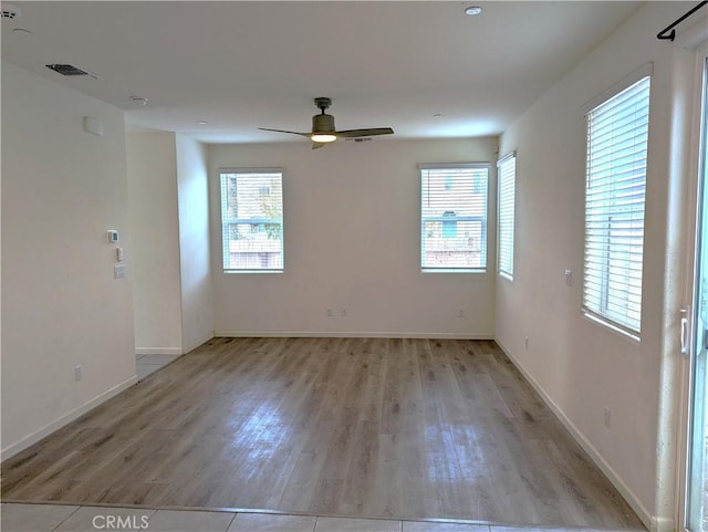 4244 Rutherford Ave, Merced, CA 95348 - empty room with visible vents, baseboards, light wood-type flooring, and a ceiling fan