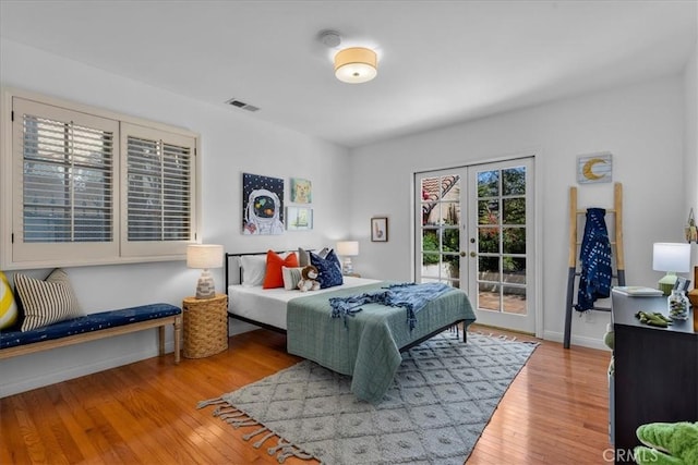 2824 Westwood Blvd, Los Angeles, CA 90064 - bedroom with visible vents, access to exterior, french doors, and wood finished floors