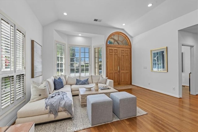 2824 Westwood Blvd, Los Angeles, CA 90064 - living area featuring wood finished floors, visible vents, baseboards, and vaulted ceiling