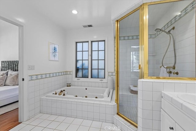 2824 Westwood Blvd, Los Angeles, CA 90064 - ensuite bathroom with visible vents, connected bathroom, a jetted tub, vanity, and a stall shower