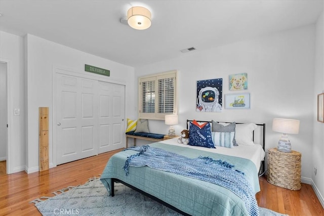 2824 Westwood Blvd, Los Angeles, CA 90064 - bedroom featuring visible vents, a closet, baseboards, and wood finished floors