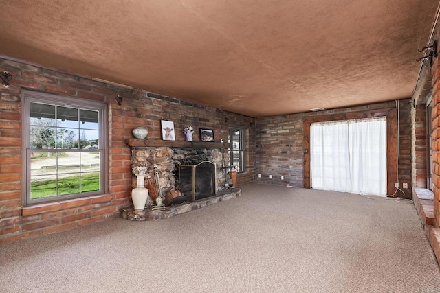 2483 Buckman Springs Rd, Campo, CA 91906 - unfurnished living room with a wealth of natural light, a fireplace, and carpet flooring