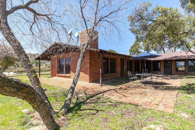 2483 Buckman Springs Rd, Campo, CA 91906 - rear view of property featuring a chimney, a patio area, and brick siding