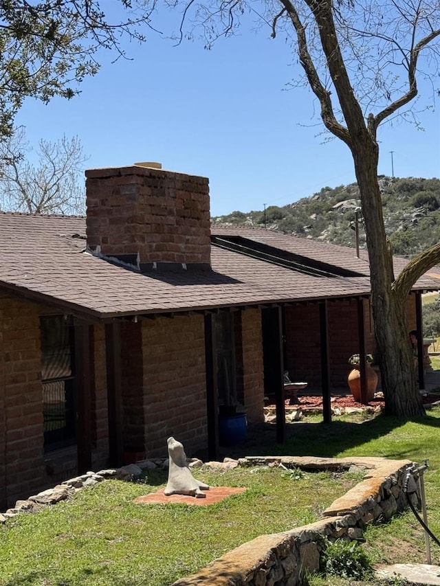 2483 Buckman Springs Rd, Campo, CA 91906 - rear view of property featuring a shingled roof, a lawn, and a chimney