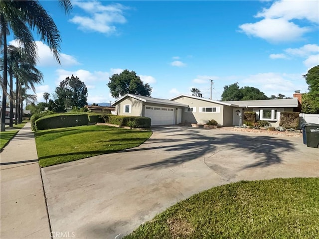 529 Esther Way, Redlands, CA 92373 - view of front facade with a front lawn, driveway, a garage, and stucco siding