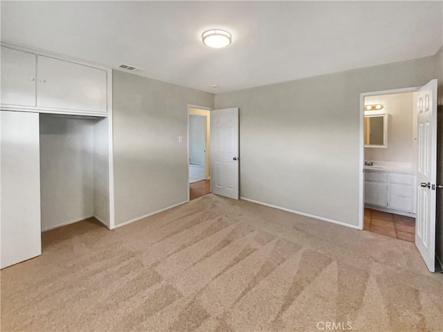 529 Esther Way, Redlands, CA 92373 - unfurnished bedroom with baseboards, visible vents, a closet, and light colored carpet