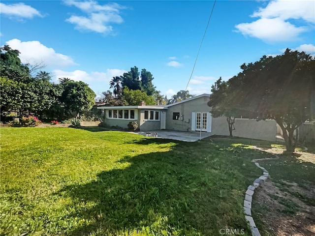 529 Esther Way, Redlands, CA 92373 - back of house featuring a patio, stucco siding, and a lawn