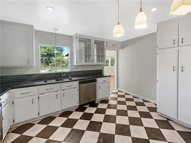 529 Esther Way, Redlands, CA 92373 - kitchen featuring stainless steel dishwasher, dark countertops, a sink, and plenty of natural light