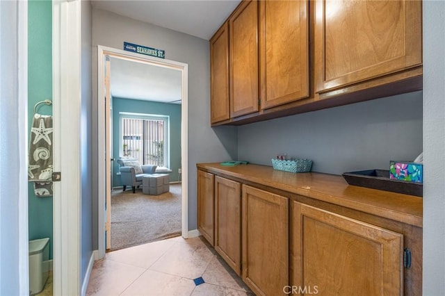 43590 Warner Trl, Palm Desert, CA 92211 - hall with baseboards, light colored carpet, and light tile patterned floors