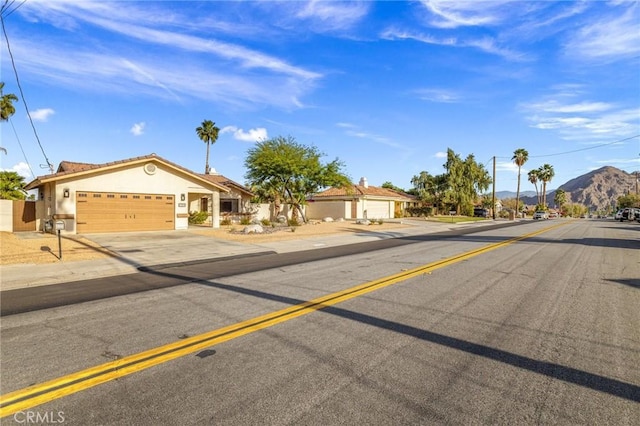 43590 Warner Trl, Palm Desert, CA 92211 - view of road with a mountain view and sidewalks
