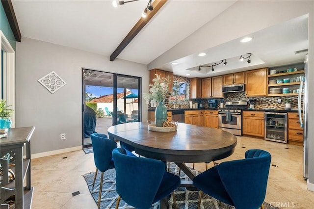 43590 Warner Trl, Palm Desert, CA 92211 - dining space with rail lighting, visible vents, lofted ceiling with beams, and wine cooler
