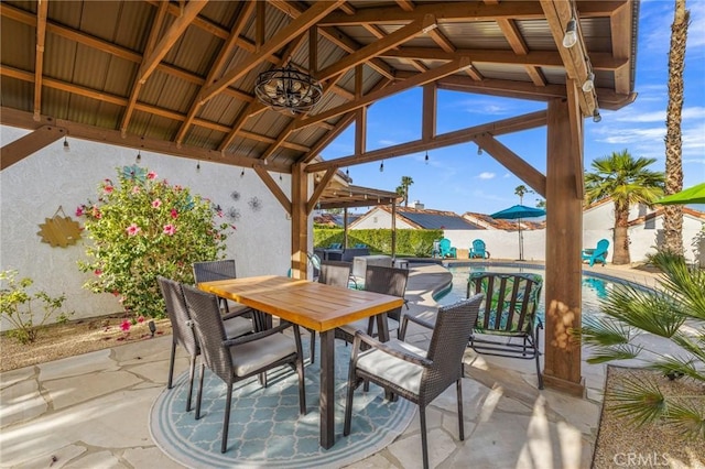 43590 Warner Trl, Palm Desert, CA 92211 - view of patio / terrace featuring a gazebo, fence, a fenced in pool, and outdoor dining space