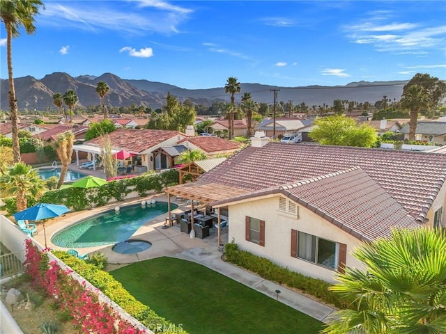43590 Warner Trl, Palm Desert, CA 92211 - exterior space featuring stucco siding, a fenced backyard, a mountain view, and a tile roof