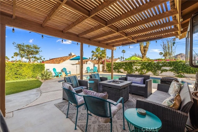 43590 Warner Trl, Palm Desert, CA 92211 - view of patio featuring a pergola, a fenced in pool, a fenced backyard, and an outdoor living space with a fire pit