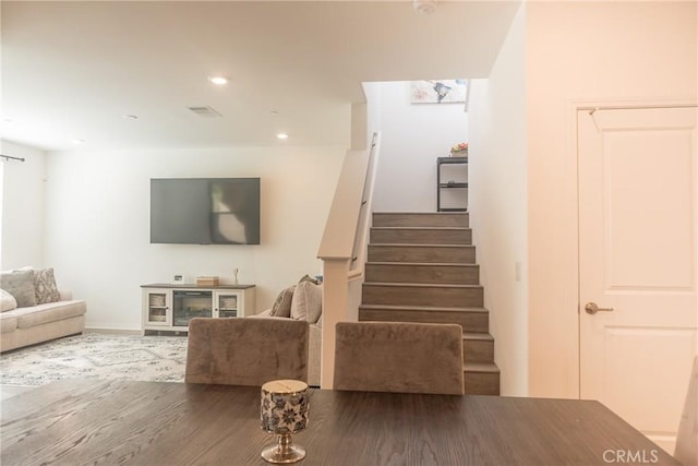 15188 Horizon St Unit 8, Fontana, CA 92336 - stairs featuring wood finished floors, baseboards, visible vents, and recessed lighting