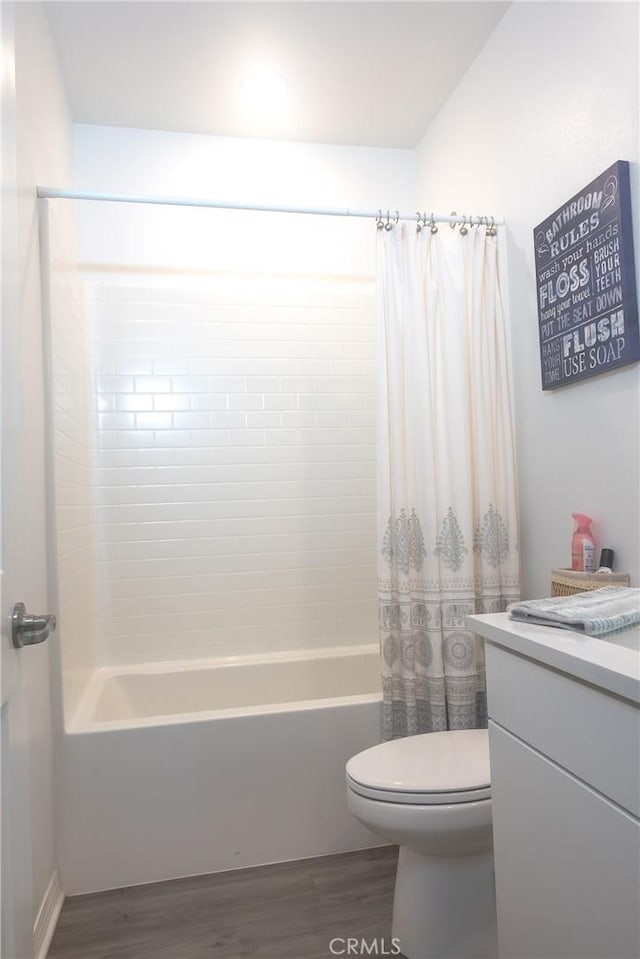 15188 Horizon St Unit 8, Fontana, CA 92336 - bathroom featuring toilet, wood finished floors, vanity, and shower / tub combo with curtain