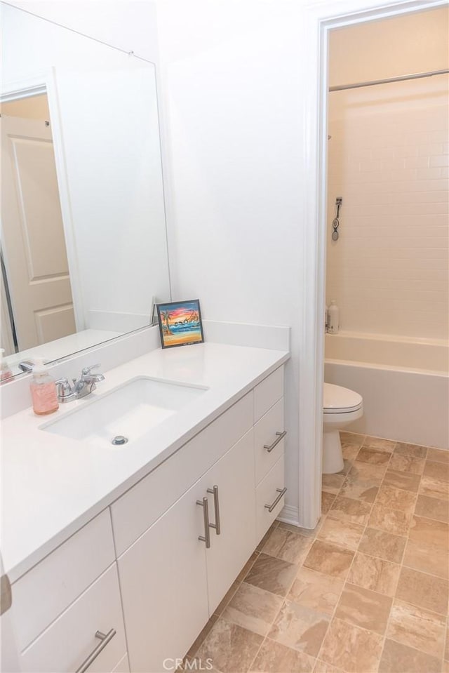 15188 Horizon St Unit 8, Fontana, CA 92336 - full bath with toilet, stone finish floor, vanity, and shower / washtub combination