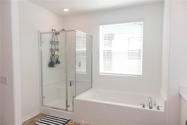 15188 Horizon St Unit 8, Fontana, CA 92336 - bathroom featuring a shower stall and a garden tub
