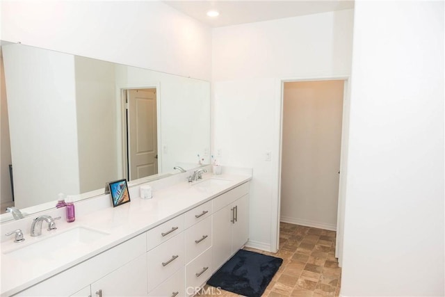 15188 Horizon St Unit 8, Fontana, CA 92336 - bathroom with recessed lighting, double vanity, stone finish floor, and a sink