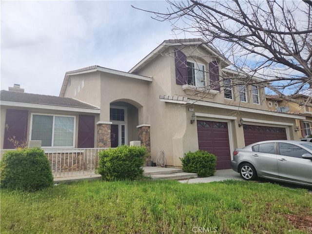 12613 Torrey Pine Rd, Moreno Valley, CA 92555 - view of front of home featuring a garage, stucco siding, and stone siding