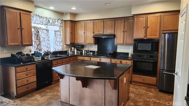 12613 Torrey Pine Rd, Moreno Valley, CA 92555 - kitchen featuring black appliances, under cabinet range hood, brown cabinets, a kitchen island, and recessed lighting