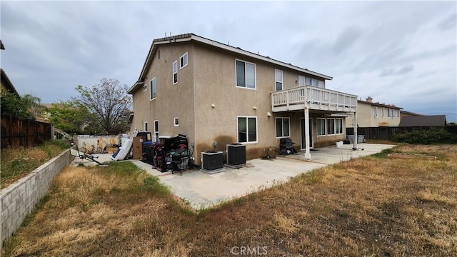 12613 Torrey Pine Rd, Moreno Valley, CA 92555 - rear view of house featuring a patio, stucco siding, and central air condition unit