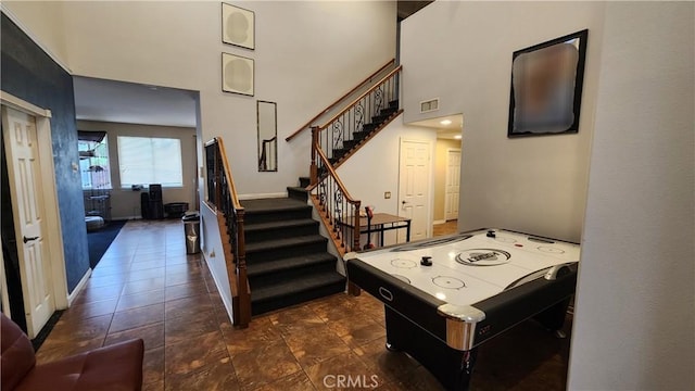 12613 Torrey Pine Rd, Moreno Valley, CA 92555 - rec room featuring a towering ceiling and baseboards
