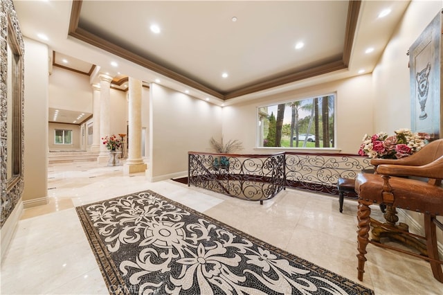 interior space with a raised ceiling, decorative columns, crown molding, recessed lighting, and marble finish floor