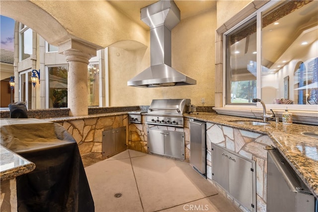 view of patio / terrace featuring area for grilling, a sink, and exterior kitchen