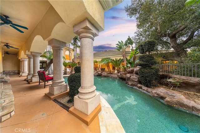 view of swimming pool featuring fence, a patio area, a ceiling fan, and a fenced in pool