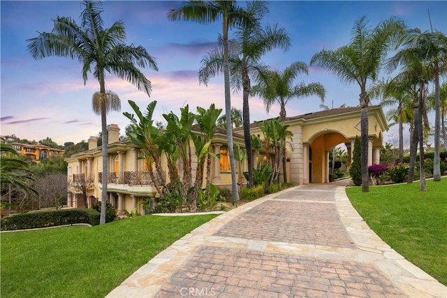 1199 Village Dr, Chino Hills, CA 91709 - mediterranean / spanish home with a yard, decorative driveway, and stucco siding