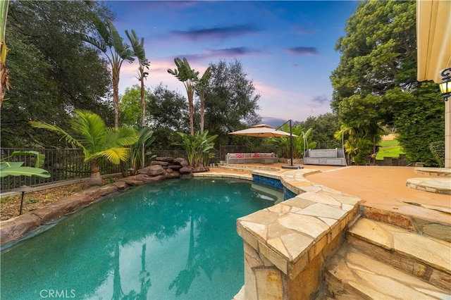view of swimming pool with a fenced in pool, a patio, and a fenced backyard
