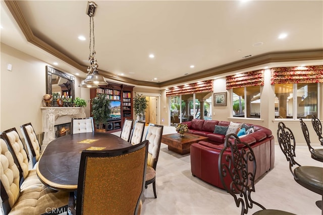 1199 Village Dr, Chino Hills, CA 91709 - dining area featuring a fireplace, recessed lighting, crown molding, and light colored carpet