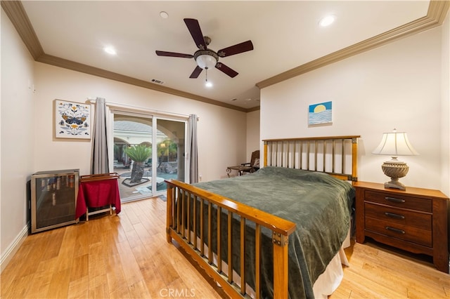bedroom featuring light wood finished floors, visible vents, access to exterior, and ornamental molding