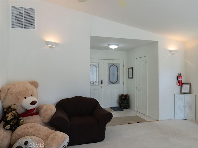 406 Delle Dr, Crestline, CA 92325 - living area with visible vents, light tile patterned flooring, light carpet, and lofted ceiling